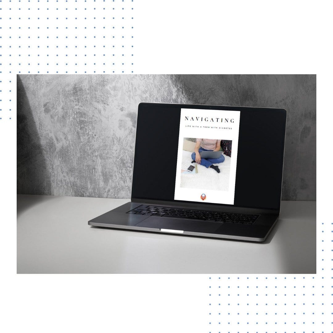 laptop sitting on grey desk open to an image of Navigating the teen years with diabetes ebook from Diabetes Advocacy