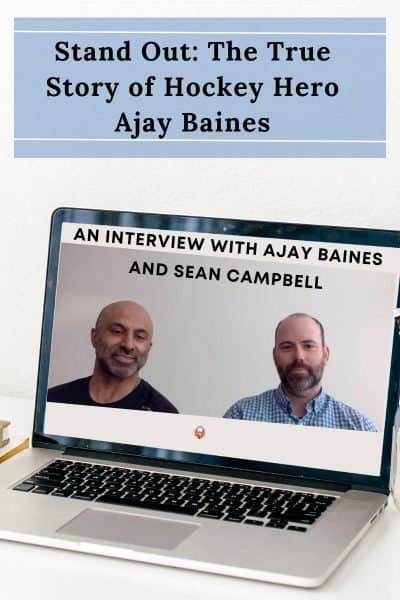 Stand out the true story of hocky hero Ajay Baines written in black on a blue background. Laptop open to an image of Ajay Baines and Sean Campbell