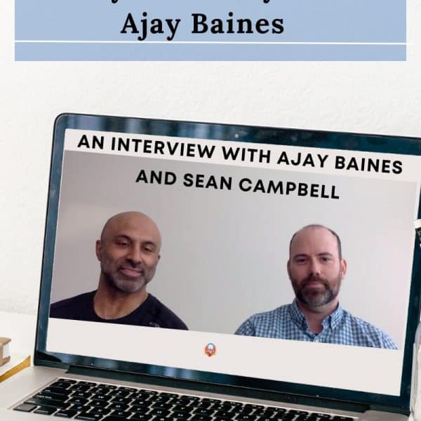 Stand out the true story of hocky hero Ajay Baines written in black on a blue background. Laptop open to an image of Ajay Baines and Sean Campbell