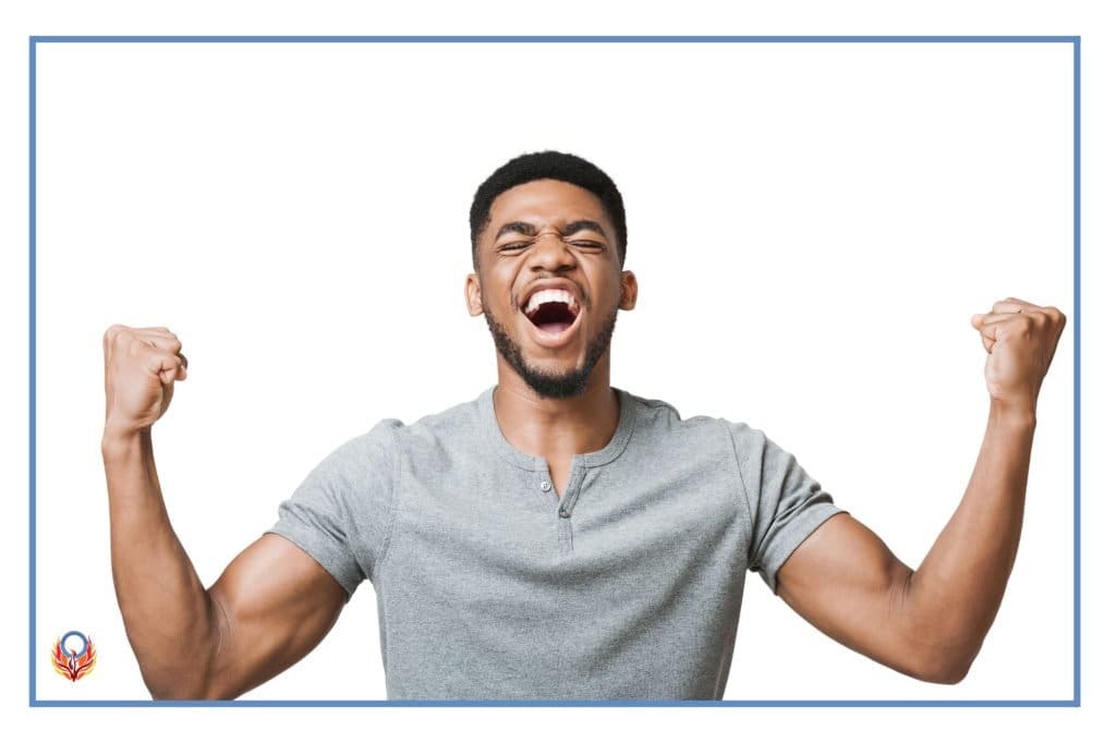 African American man with fists in the air in excitement